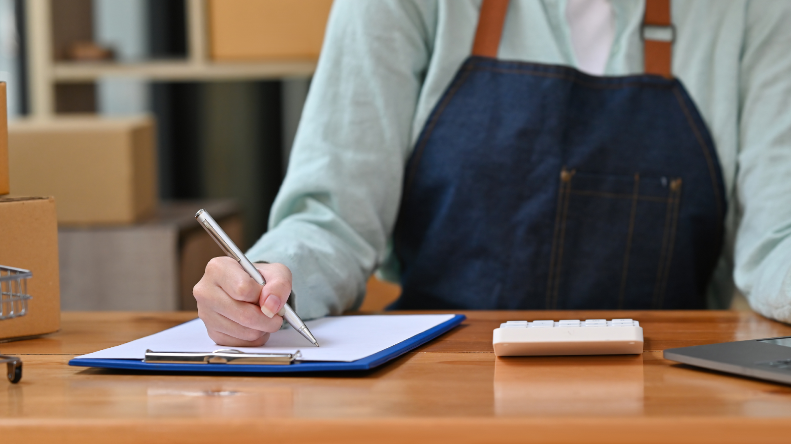 SME business owner writing notes